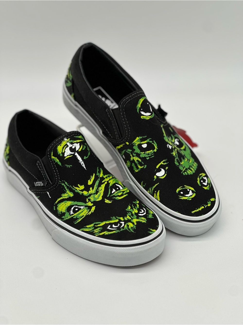 Vans Black Slip-On Sneakers with Neon Green Monster Faces